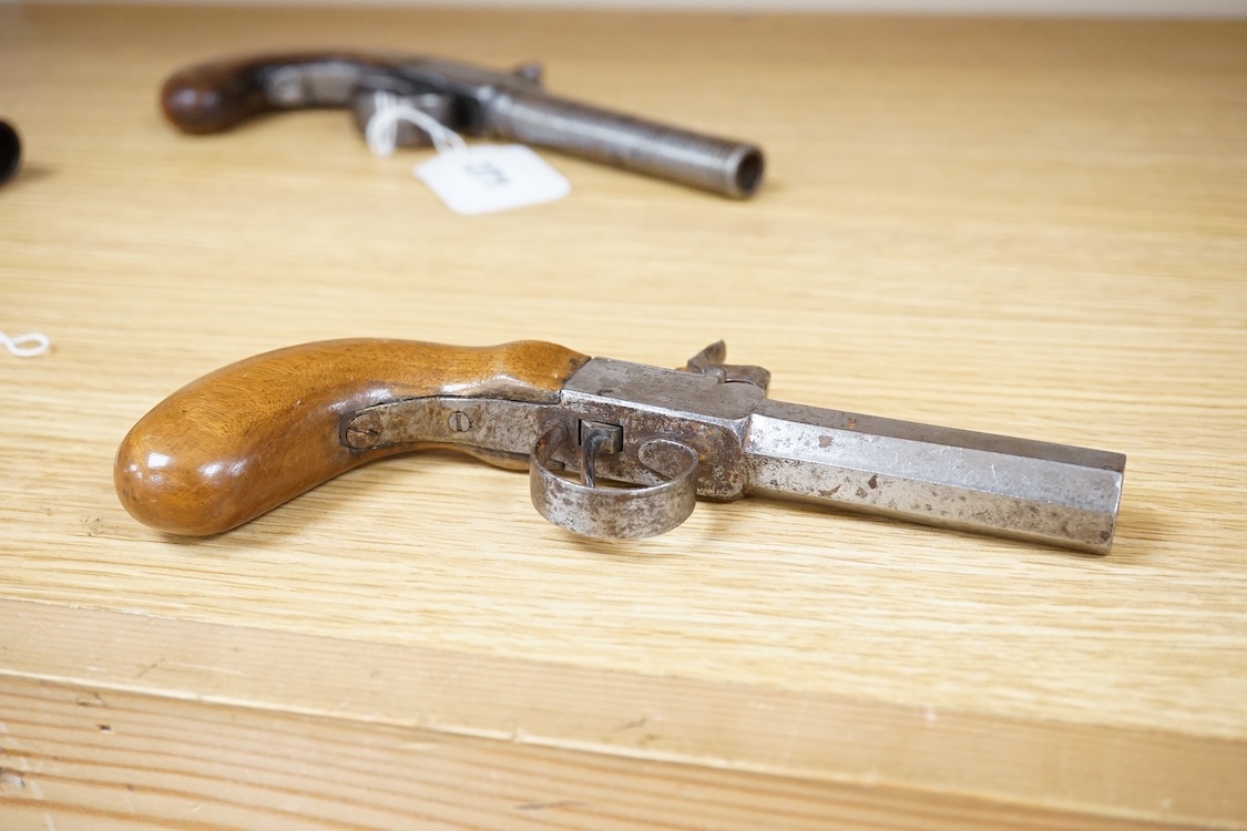 A Belgian boxlock percussion pocket pistol with octagonal barrel, hammer offset for sighting, and rounded wooden butt